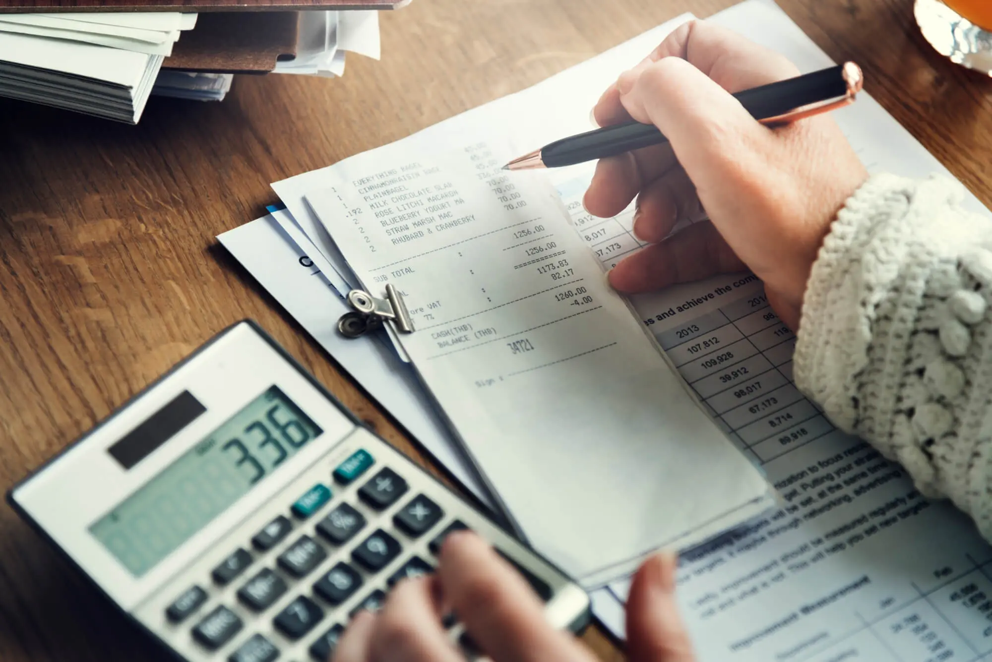 desk with calculator and papers