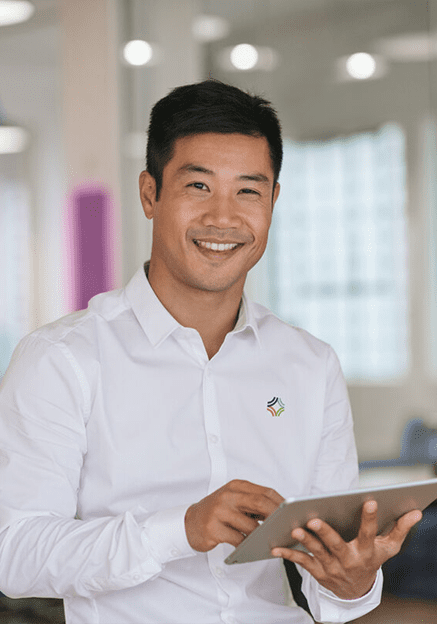 man with tablet smiling