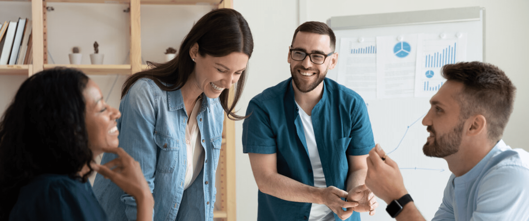 team laughing in a meeting