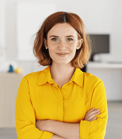 woman smiling with arms crossed