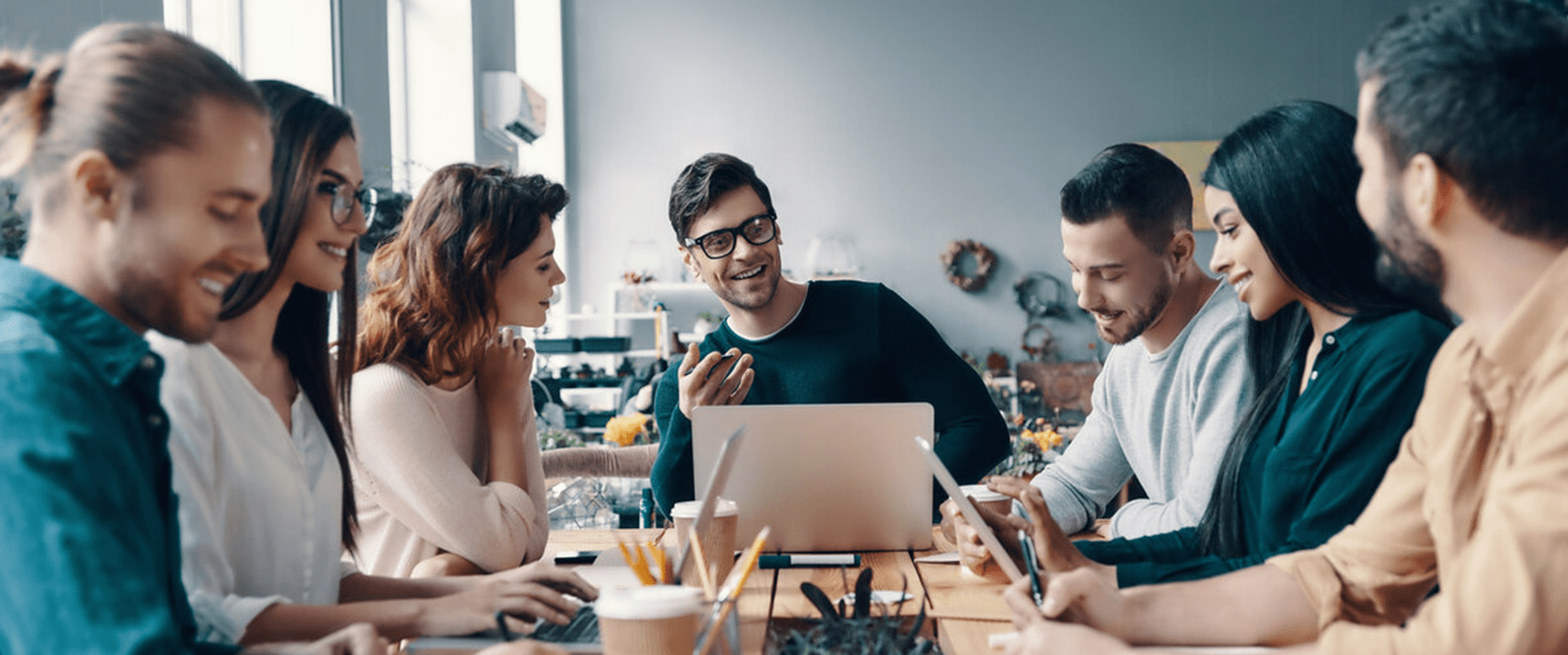 team around a table in a meeting